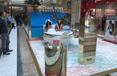 Blackjack Promotions, a leader in retail-focused experiential marketing, has delivered a complete package for the launch activity of Michael Kors’ new perfume, Wonderlust, in Manchester’s Trafford Centre, with the activation culminating at Birmingham’s Bull Ring today (October 4, 2016). Working from an initial brief and a 30’ TV ad, Blackjack developed the creative, designed the stand, created a social sharing mechanism, recruited and provided brand ambassadors, as well as full build and installation.
